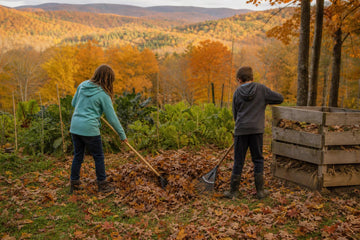 Children raking colorful fall leaves beside a backyard garden and compost bin with West Virginia's Appalachian hills in autumn color behind them